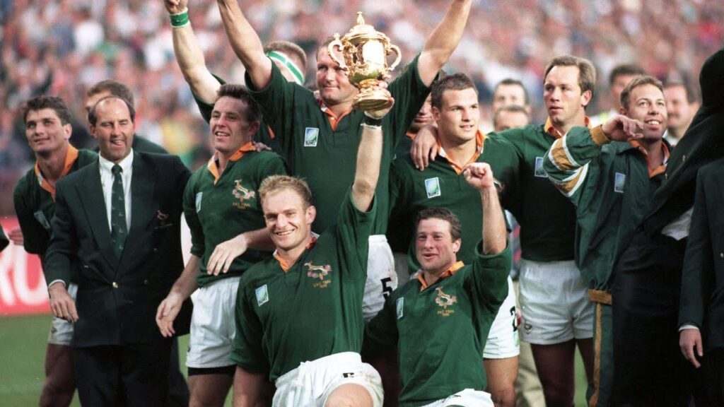 The 1995 Rugby World Cup champions hosting the trophy in victory. Springbok Rugby Squad united South Africa through the Power of PLAY.  